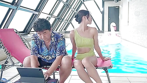 Asian brunette has a huge ass and a sexy pussy in the pool